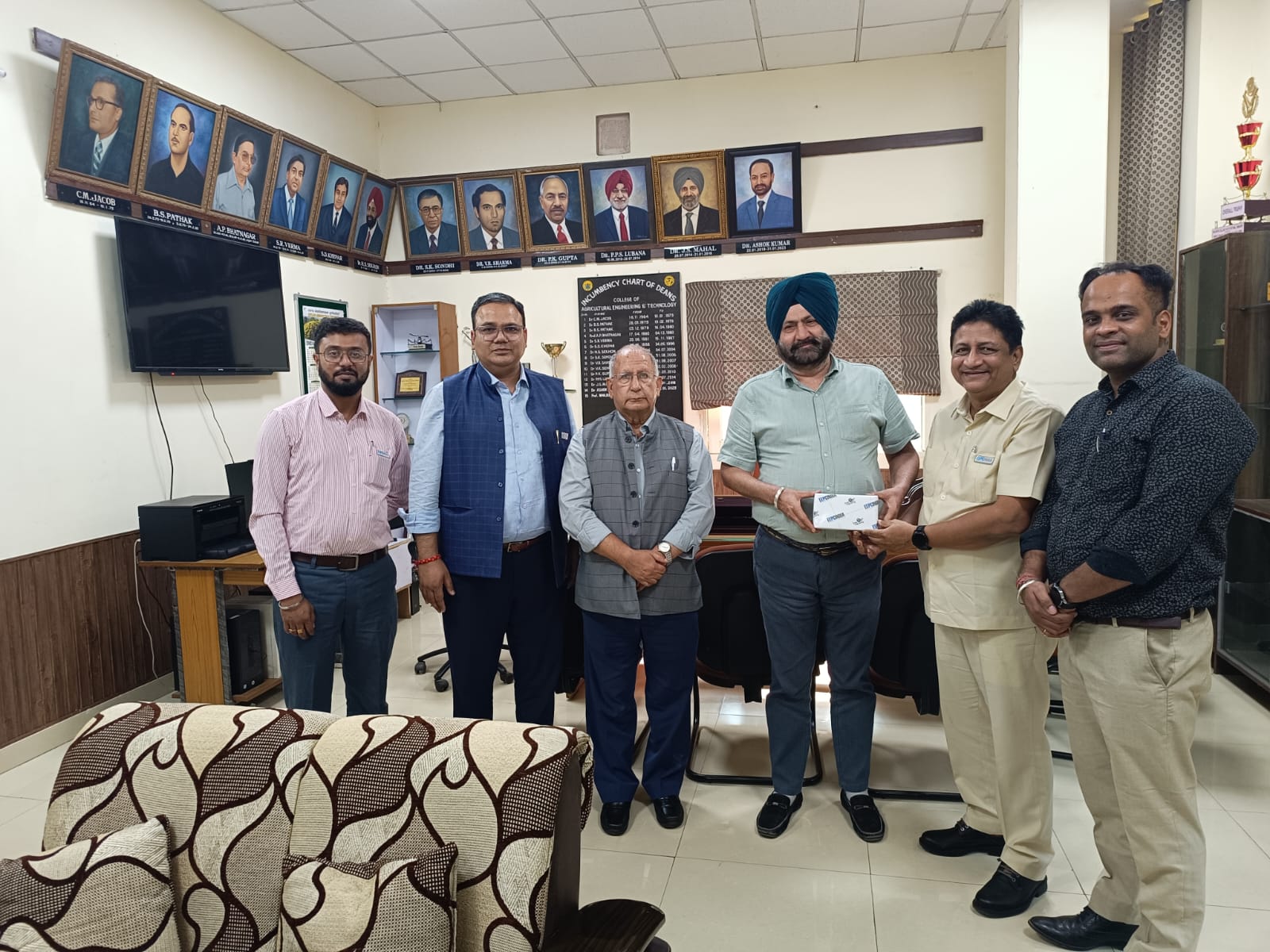 EEPC India Technology Centre's meeting with Punjab Agriculture University, Ludhiana. Mr D J Basu, Director (Personnel & Administration), EEPC India and Coordinator, EEPC India Technology Centre (second from right) presenting memento to Dr Prof Manjeet Singh, Dean, College of Agriculture Engineering & Technology, Punjab Agricultural University (third from right). Dignitaries present- Mr Ajay Kumar Goswami, Deputy Regional Chairman (NR), EEPC India (third from left); Mr Rakesh Suraj, Regional Director (NR), EEPC India (second from left); Mr Gaurav Gupta, Assistant Director, EEPC India (SRO), Jalandhar (far right) and Mr Shibasish Sen, 3D Design Engineer, EEPC India Technology Centre (far left).