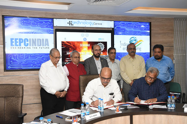 MoU being signed between EEPC India and CSIR- NML, Jamshedpur. Mr Adhip Mitra, Additional Executive Director & Secretary (left seated) and Dr Amitava Mitra, Chief Scientist & Head, CSIR-NML, Jamshedpur  (seated on the right). Standing  behind from left - Mr B D Agarwal, Regional Chairman (ER), EEPC India; Mr Mahesh K Desai, Sr Vice Chairman, EEPC India; Mr Ravi Sehgal, Chairman, EEPC India; Mr Arun Kumar Garodia, Vice Chairman, EEPC India; Dr Indranil Chattoraj, Director, CSIR -NML, Jamshedpur; and Mr Bhaskar Sarkar, Advisor, EEPC India Technology Centre